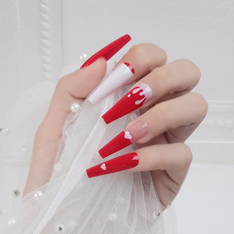 Künstlerische lange Stiletto Press-On Nägel mit Herz- und Tropfen-Design Karnz