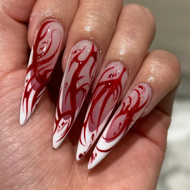 Kunstvolle Stiletto-Nägel mit künstlerischem Farbverlauf Karnz