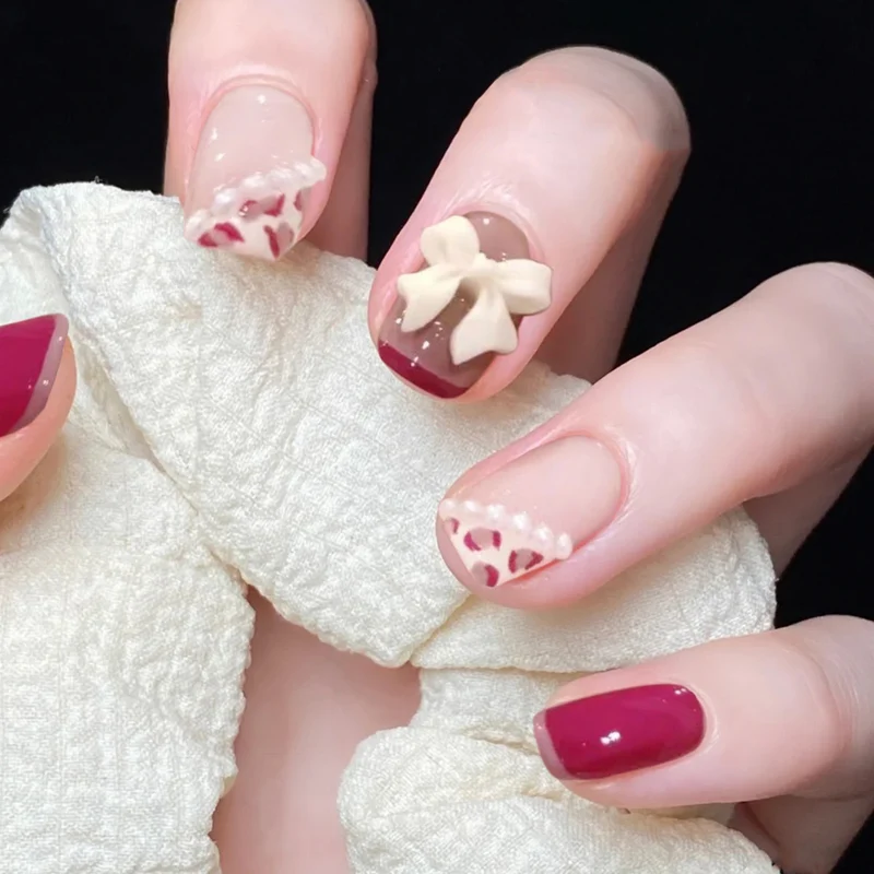 Kunstvolle Nagelkunst mit elegantem Schleifen-Design Karnz