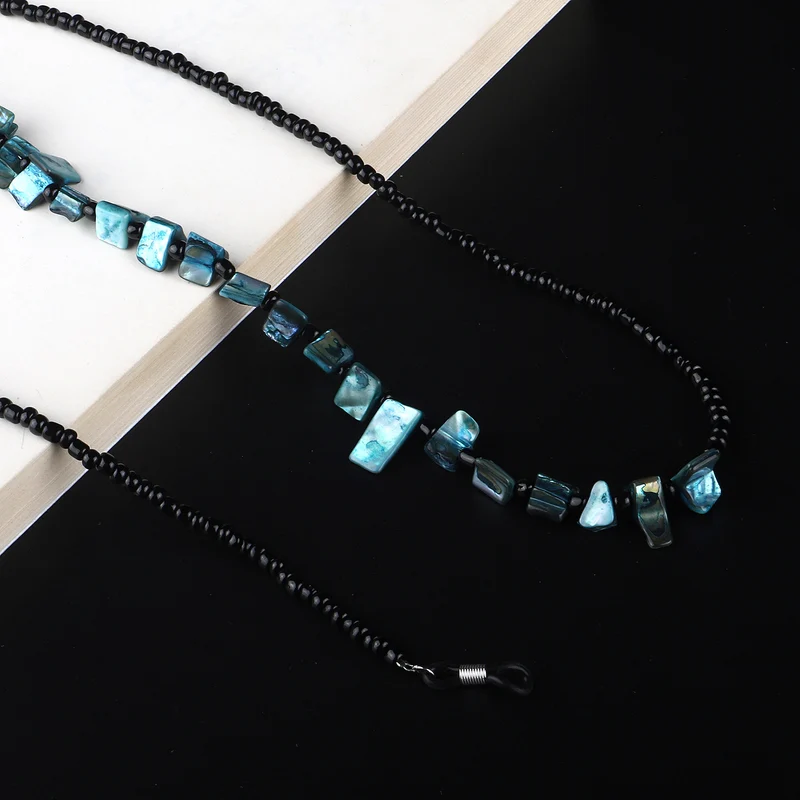 Perlenbrillenhalter mit natürlichen Muschelakzenten Karnz