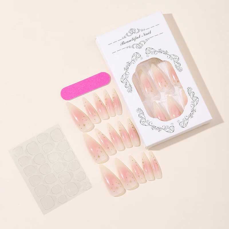 Kunstnagelset mit zartem Ombre-Design und glamourösen Sternakzenten Karnz