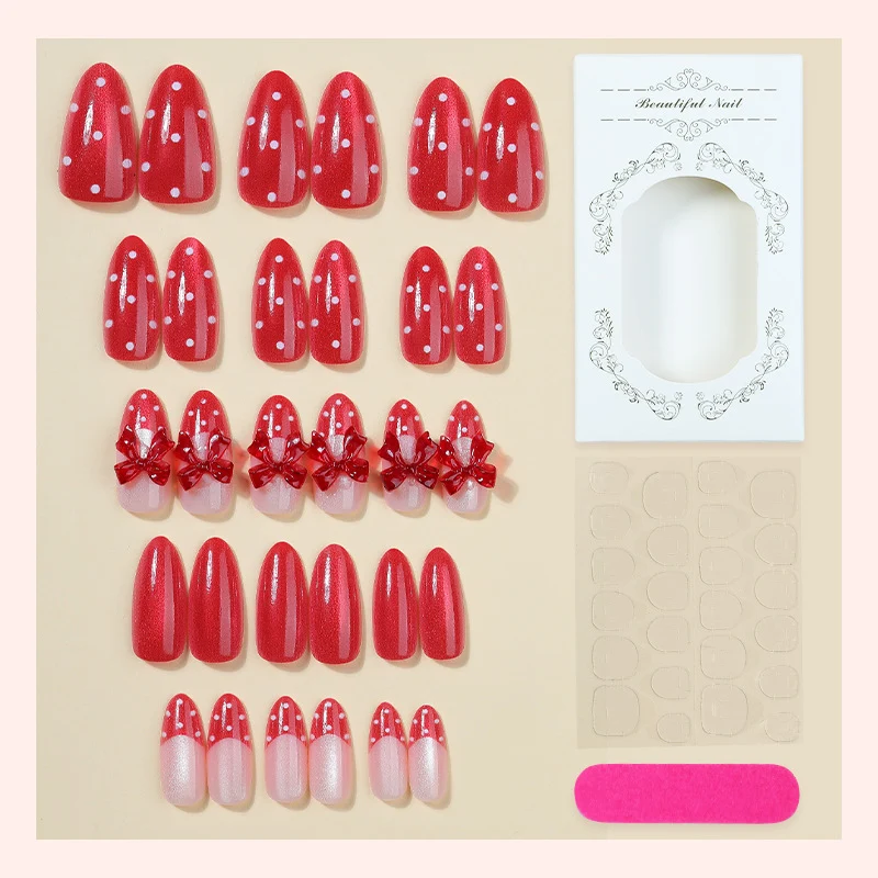 Kunstnagelset mit verspielten roten Polka Dots und Schleifen Akzenten Karnz