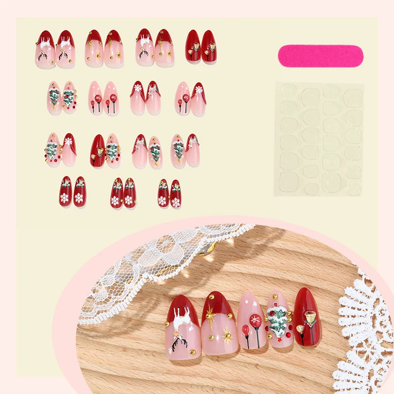 Kunstnagelset mit festlichen Weihnachtsmotiven und funkelnden Akzenten Karnz