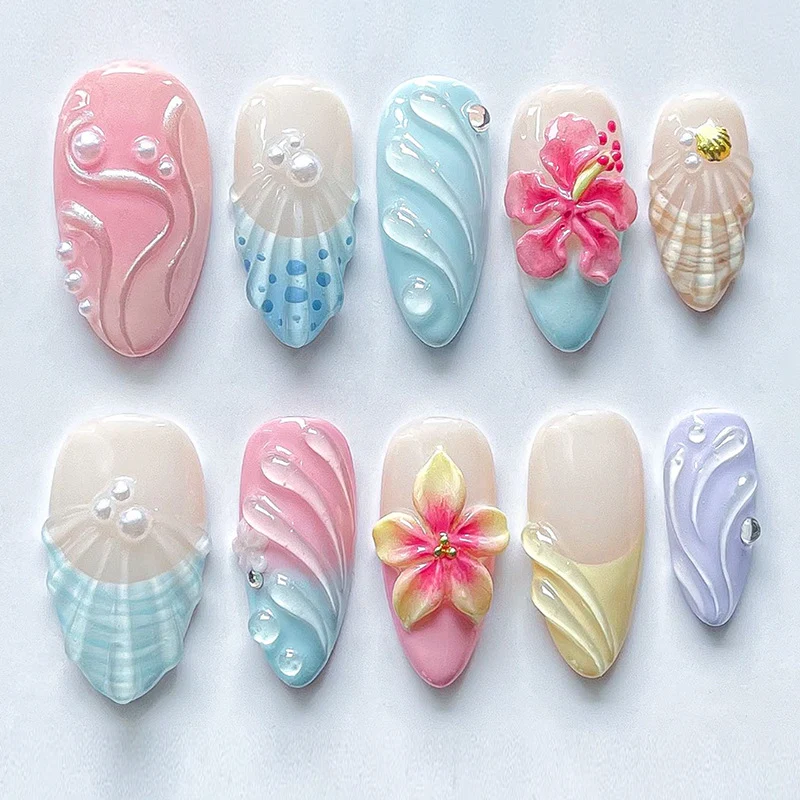 Künstliche Nagelset mit auffälligen Muschel- und Blütenmotiven Karnz